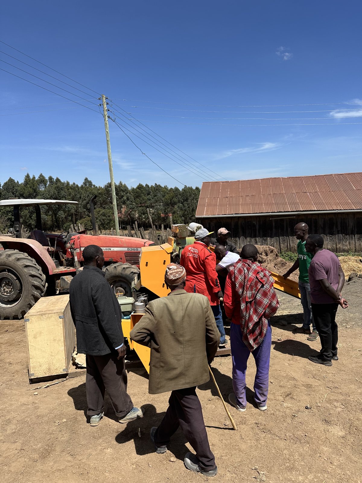 Timothy's team and neighbours gathered around the new silage baler wrapper during commissioning in Narok County